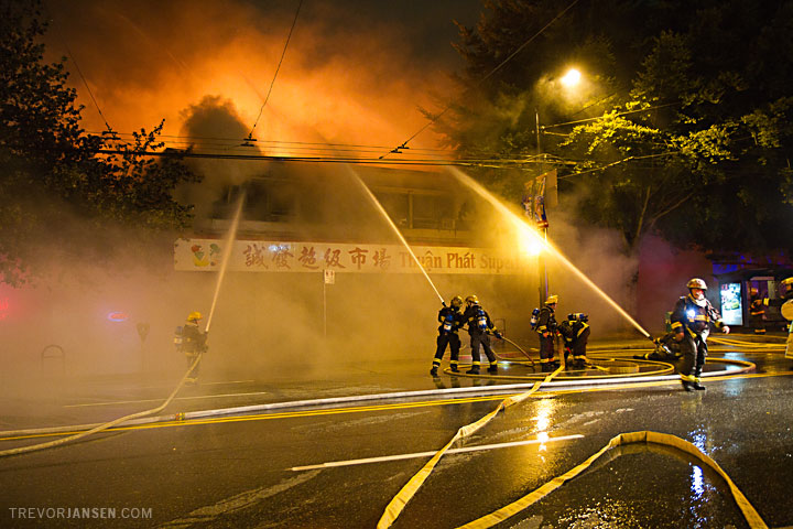 Firemen douse a blaze at Broadway and Prince Edward, Vancouver
