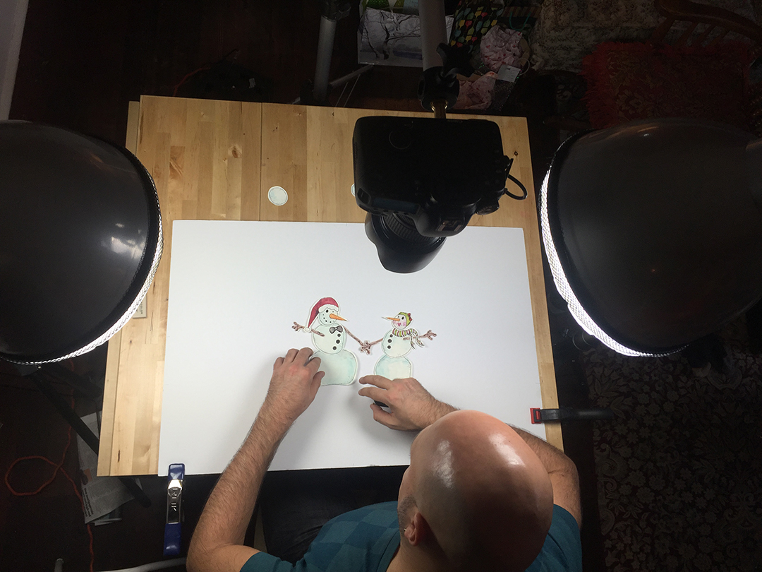 Overhead view of process work in creating a virtual Christmas card