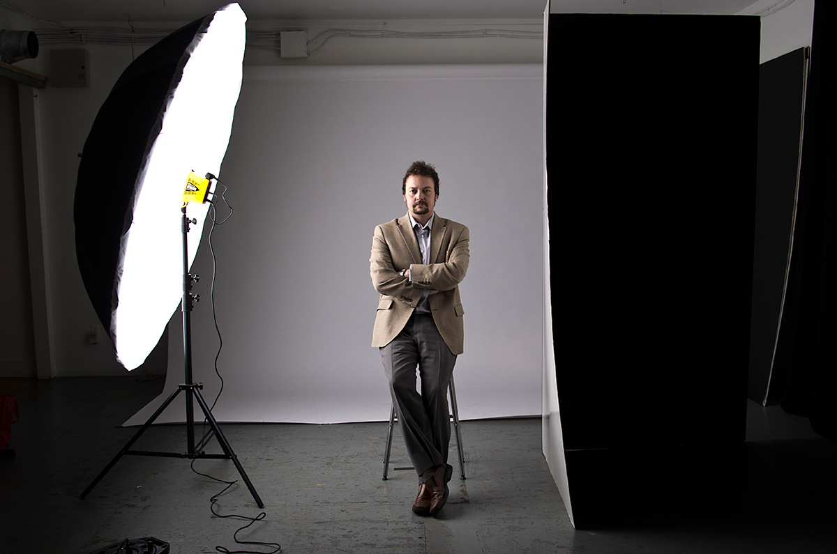 Kris Sigurdson sits for his portrait for an academic periodical